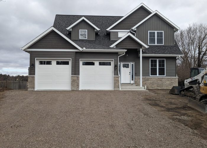 A grey two-story custom home.